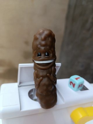 Juego Baño Boom con caca y dado