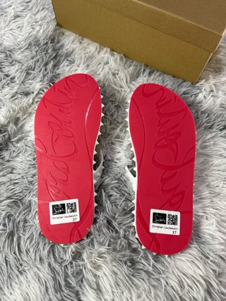 Christian Louboutin studded flip flops