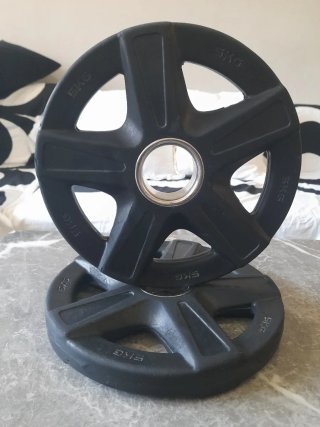 Dos discos pesas Fit Cross 5kg de 50mm.