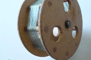 Due mulinelli da pesca Catchmaster C244 e uno in legno