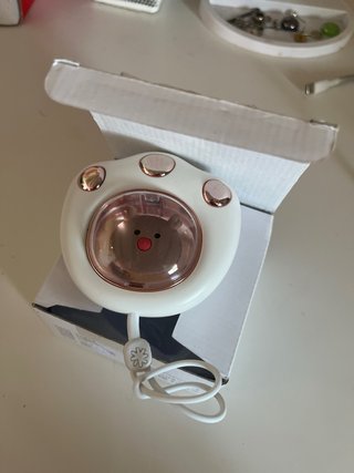 Calentador de manos con diseño de patita de gato