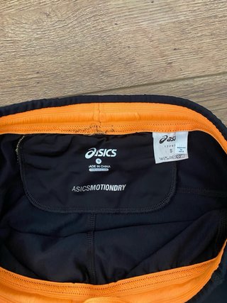 Pantaloncini da corsa Asics nero e arancione