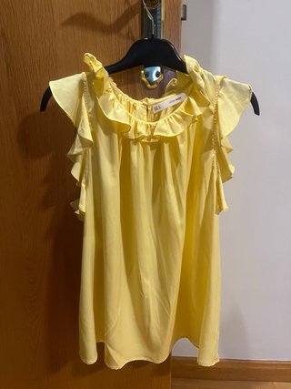 Blusa Sfera sin mangas con volantes