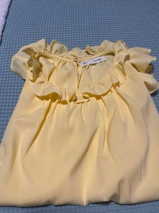 Blusa Sfera sin mangas con volantes