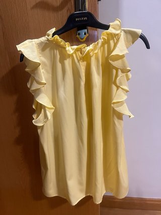Blusa Sfera sin mangas con volantes