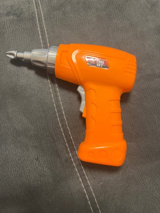 Taladro de juguete naranja