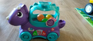 Dinosaurio Fisher-Price escupe bolas