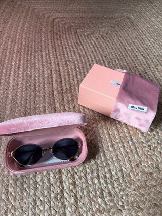Gafas Miu Miu doradas