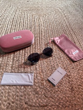 Gafas Miu Miu doradas