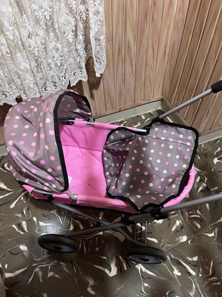Carro para muñecas rosa con capota