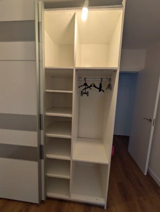 Armario doble blanco y gris marca IKEA.