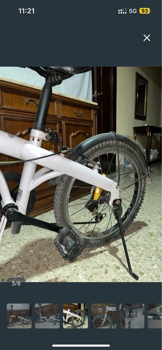 Bicicleta Plegable blanca con cesta