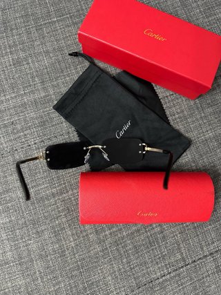 Gafas de sol Cartier negras y doradas
