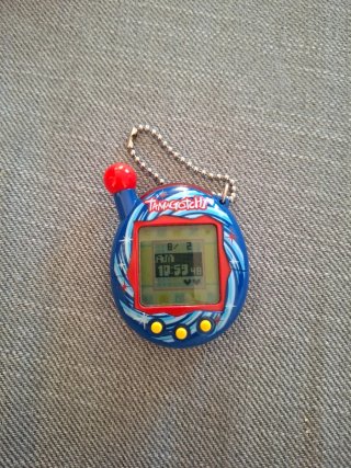 Tamagotchi Bandai azul con llavero