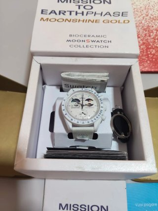 OMEGA SWATCH Earthphase Moonshine Gold NUOVO