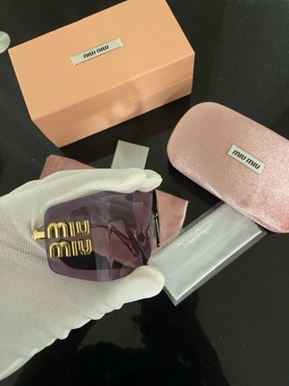 Gafas de sol Miu Miu rosa degradado con estuche