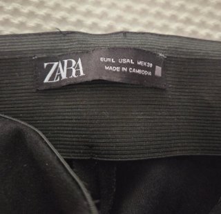 Pantalón Zara flecos negro Talla L. Mas bien es M
