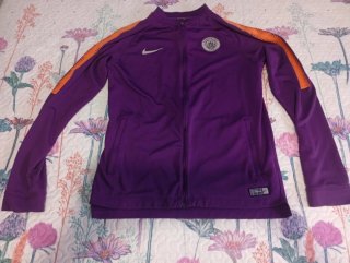 Chaqueta Nike Morada y Naranja. FLUORESCENTE
