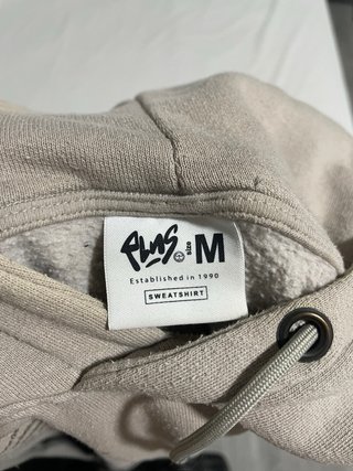 Sudadera beige con estampado gráfico