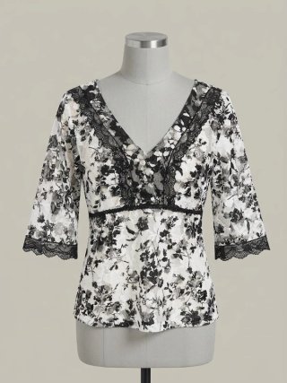 Blusa de encaje floral blanco y negro