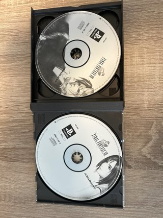 Console PS1 grigia con 3 giochi