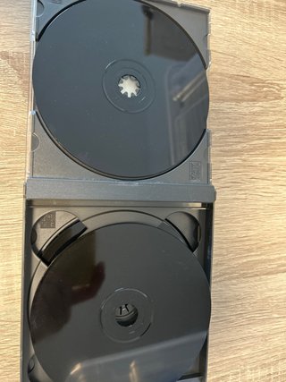 Console PS1 grigia con 3 giochi
