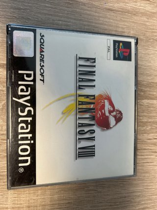 Console PS1 grigia con 3 giochi