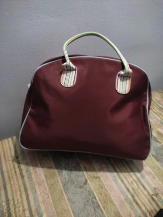 Bolsa de lona con vivos y asas