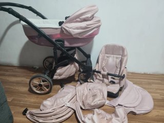 Carro de bebé rosa seminuevo