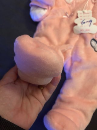 Pelele rosa con orejitas y dibujo