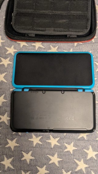 Nintendo 2DS XL con 4 juegos y cargador con funda