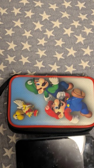 Nintendo 2DS XL con 4 juegos y cargador con funda