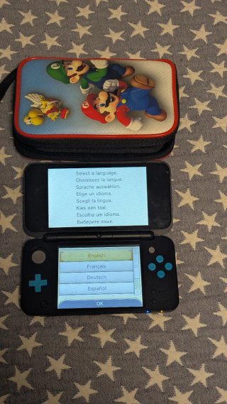 Nintendo 2DS XL con 4 juegos y cargador con funda
