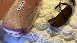Gafas de sol Miu Miu marrones y doradas