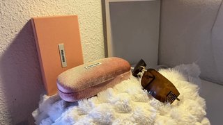 Gafas de sol Miu Miu marrones y doradas