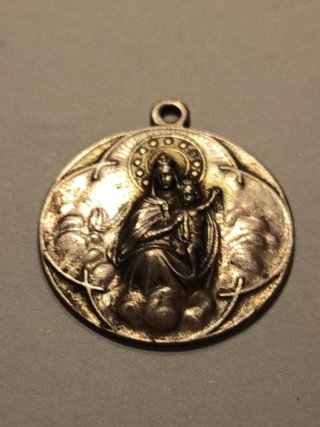 Medalla religiosa antigua de plata