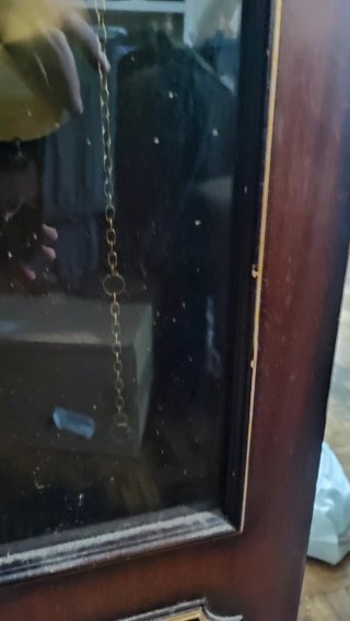 Reloj de péndulo de madera