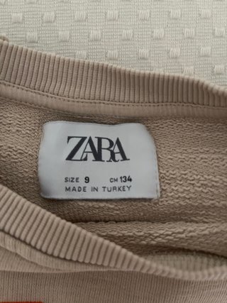 Sudadera beige con letras naranjas Talla S