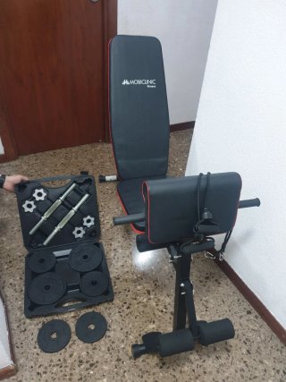 Conjunto de banco de ejercicios y pesas