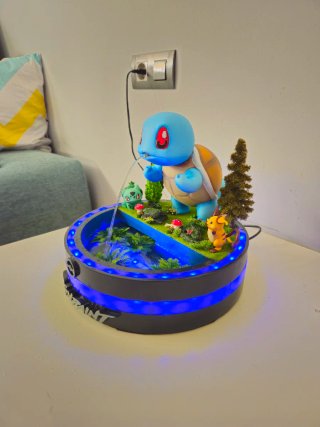 Fuente de agua Pokémon con figuras