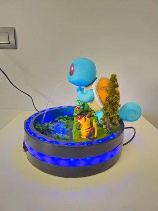 Fuente de agua Pokémon con figuras