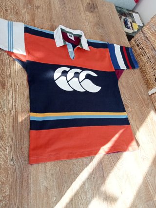 Polo Canterbury rayas naranja y azul