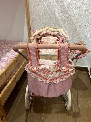 Carrito de muñecas rosa Martina