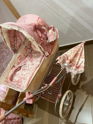 Carrito de muñecas rosa Martina