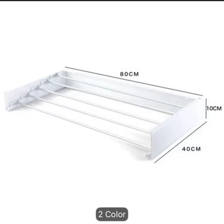 Tendedero plegable de pared blanco.