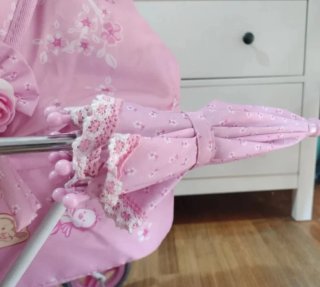 Carro o cochecito de muñecas rosa