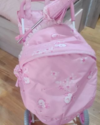 Carro o cochecito de muñecas rosa