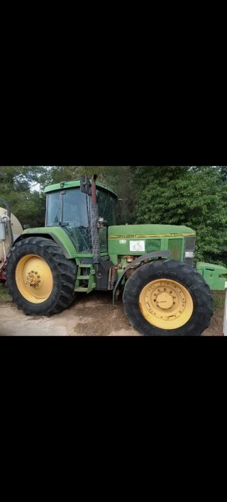 Tractor John Deere 7700 con cuba Gili