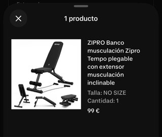 Rack de pesas, banco y discos para peso libre.