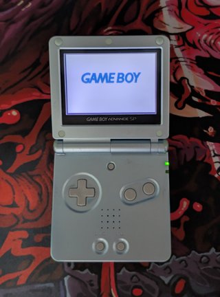 Nintendo Game Boy Advance SP + cargador + manuales